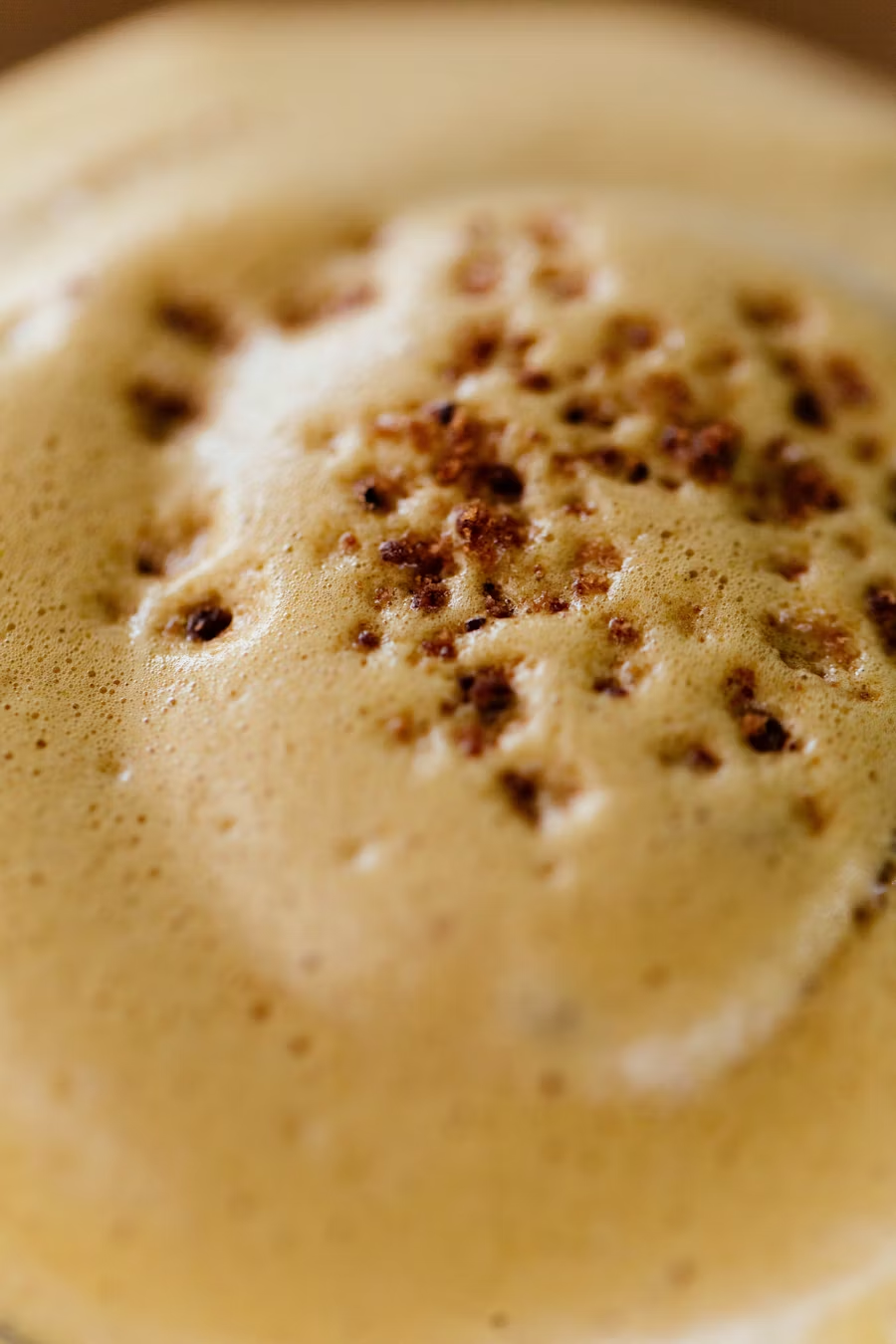 Graphic depicting a hexagonal cropped photo of an interior room design with grid lines along its borders.