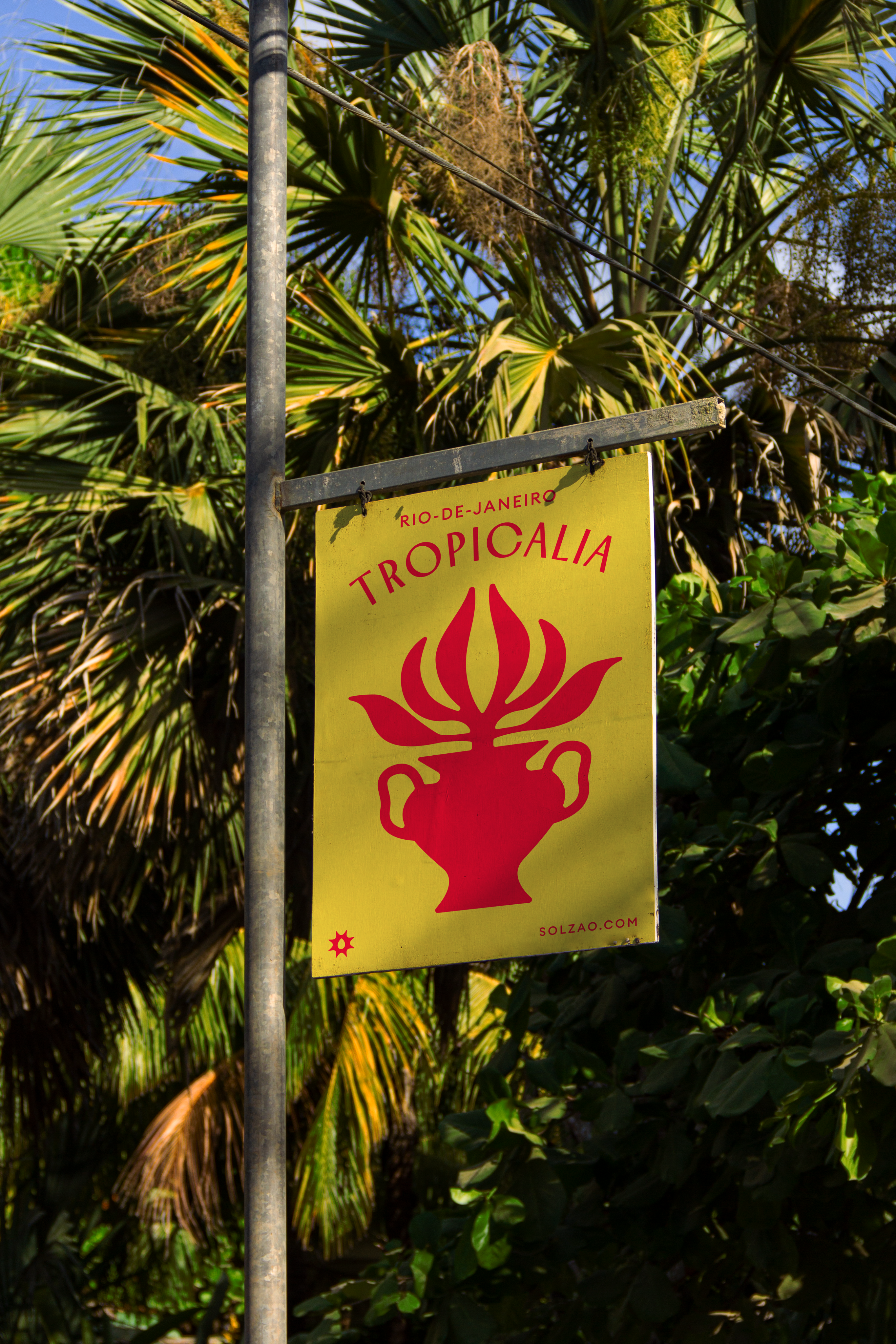 Graphic of a typography specimen showing the alphabet and numerals on top of a dark gray background.